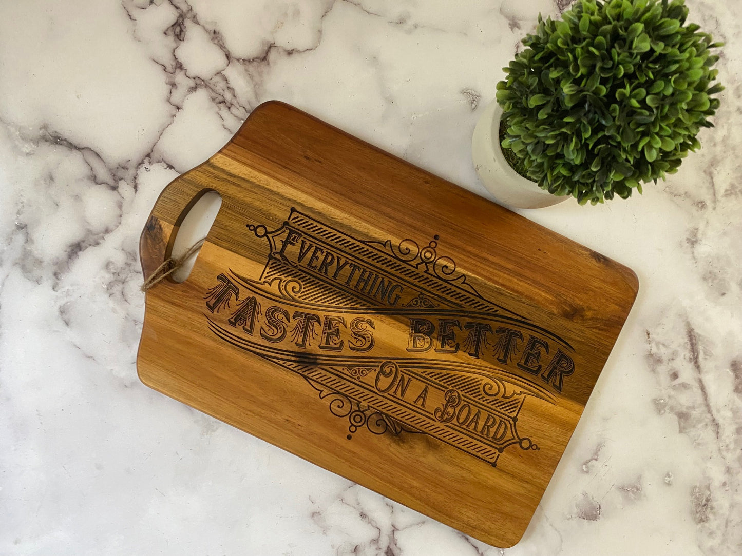 Vintage look "Everything Tastes Better on a Board" charcuterie board with cut out handle