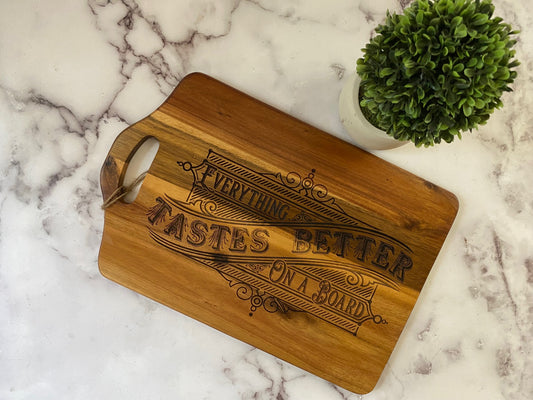Vintage look "Everything Tastes Better on a Board" charcuterie board with cut out handle