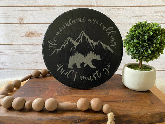 The Mountains are Calling and I Must Go Slate sign with Bear