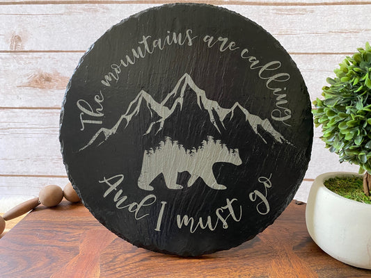 The Mountains are Calling and I Must Go Slate sign with Bear